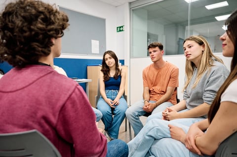 Group of diverse students actively listening and communicating during round table discussion — relapse prevention strategies, Cascadia Bountiful Life Bremerton WA